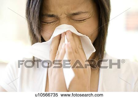 Woman sneezing View Large Photo Image Stock Photography - Woman sneezing. Fotosearch