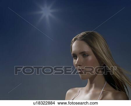 Picture - Woman sunbathing. Fotosearch