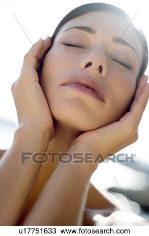 Stock Image - Woman sunbathing. Fotosearch