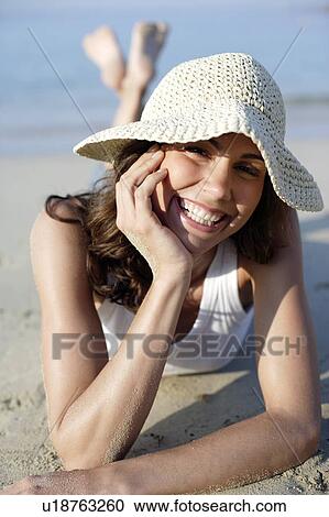 Woman wearing a sunhat View Large Photo Image Stock Image - Woman wearing a sunhat. Fotosearch