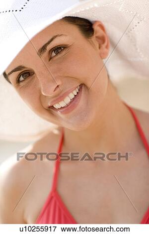Woman wearing a sunhat View Large Photo Image Stock Photo - Woman wearing a sunhat. Fotosearch