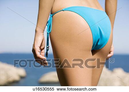 Stock Photography - Woman wearing bikini bottom. Fotosearch