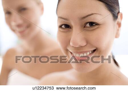 Stock Image - Women relaxing at a spa. Fotosearch