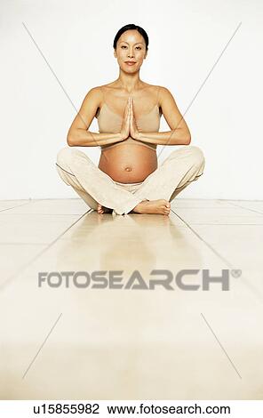 Stock Image - Yoga in pregnancy. Fotosearch