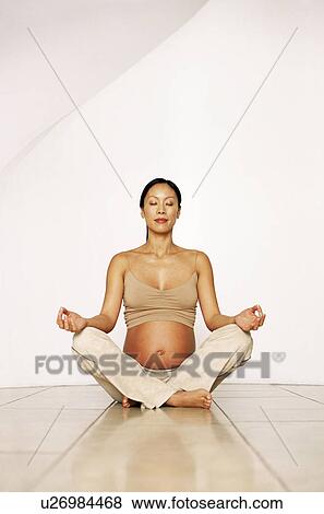 Stock Photo - Yoga in pregnancy. Fotosearch