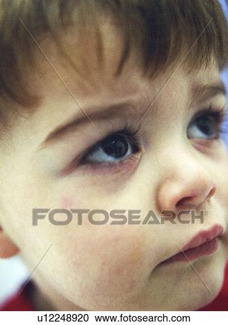 Stock Image - Young boy's face. Fotosearch