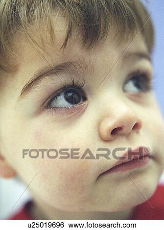 Stock Photograph - Young boy's face. Fotosearch