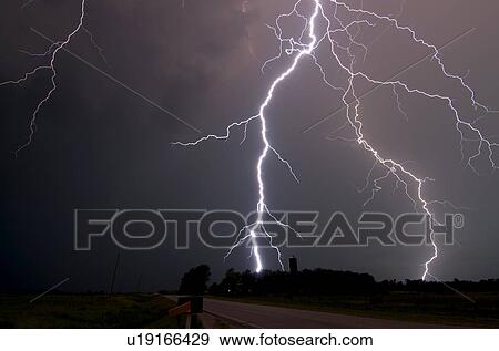 Stock Photo - A lightning bolt hits a farm, East of Princeton, Kansas, USA. Fotosearch