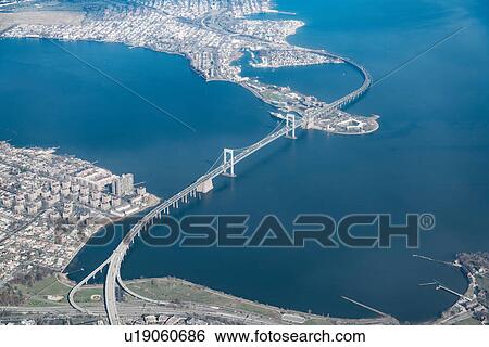 Stock Photograph - Aerial view of bridge crossing East river, New York, USA. Fotosearch