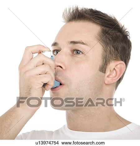Picture - Asthma inhaler use. Fotosearch