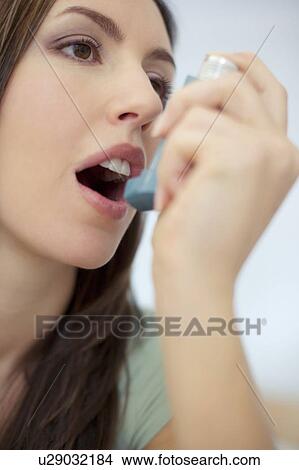 Picture - Asthma inhaler use. Fotosearch