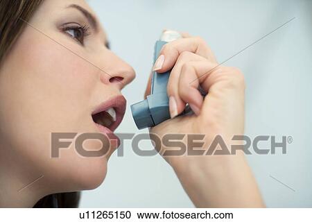 Asthma inhaler use View Large Photo Image Stock Image - Asthma inhaler use. Fotosearch