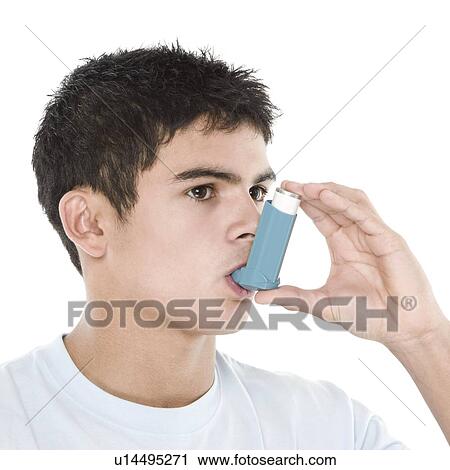 Stock Image - Asthma inhaler use. Fotosearch