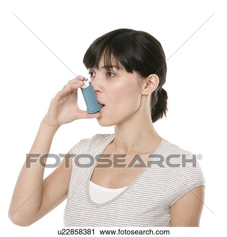 Stock Image - Asthma inhaler use. Fotosearch
