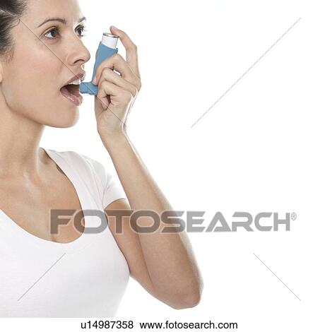 Asthma inhaler use View Large Photo Image Stock Photo - Asthma inhaler use. Fotosearch