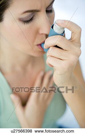 Asthma inhaler use View Large Photo Image Stock Photo - Asthma inhaler use. Fotosearch
