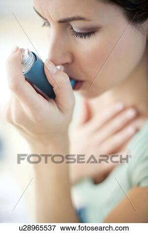 Asthma inhaler use View Large Photo Image Stock Photo - Asthma inhaler use. Fotosearch