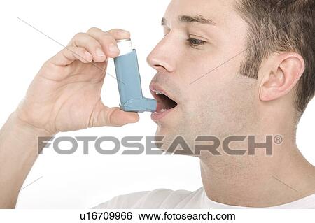 Stock Photograph - Asthma inhaler use. Fotosearch