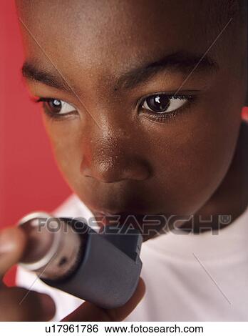 Stock Photograph - Asthmatic boy. Fotosearch