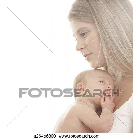 Baby being cuddled by her mother View Large Photo Image Stock Image - Baby being cuddled by her mother. Fotosearch