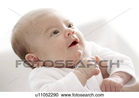 Baby being held View Large Photo Image Stock Image - Baby being held. Fotosearch