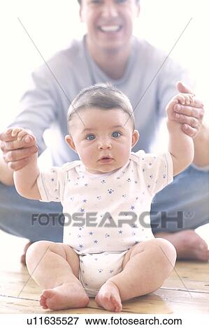 Stock Photo - Baby boy and father. Fotosearch