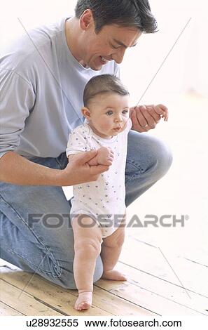 Stock Photography - Baby boy and father. Fotosearch