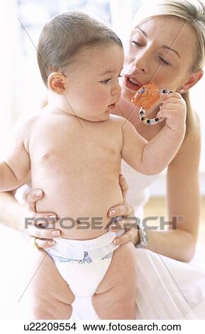Picture - Baby boy and mother. Fotosearch