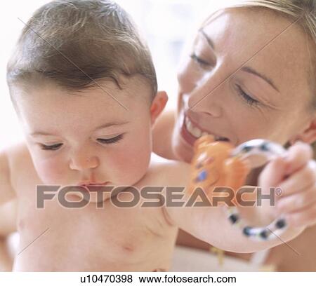 Stock Photo - Baby boy and mother. Fotosearch