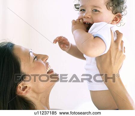 Stock Photography - Baby boy and mother. Fotosearch