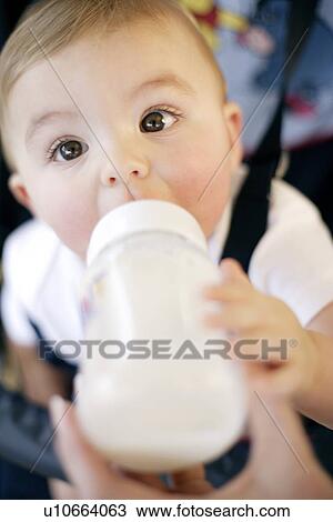 Baby drinking View Large Photo Image Stock Image - Baby drinking. Fotosearch