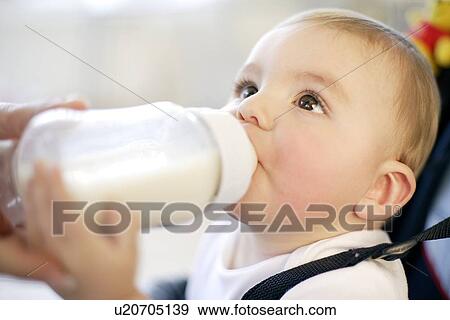 Stock Photo - Baby drinking. Fotosearch