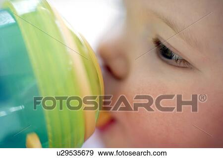 Stock Photo - Baby drinking. Fotosearch