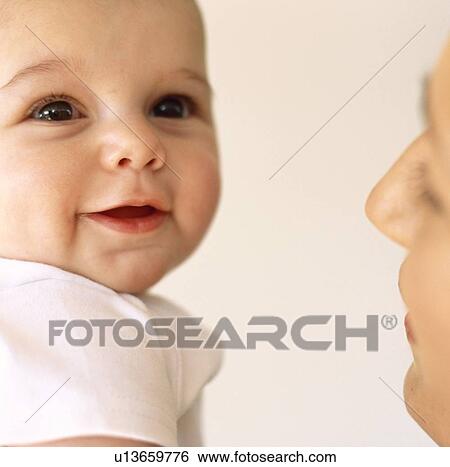 Stock Photograph - Baby girl and mother. Fotosearch
