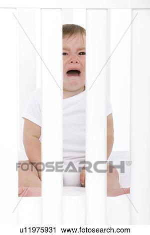 Stock Image - Baby girl crying. Fotosearch