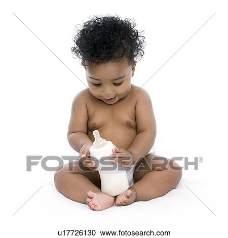 Baby girl with bottle of milk View Large Photo Image Stock Image - Baby girl with bottle of milk. Fotosearch
