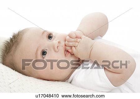 Stock Image - Baby lying on a blanket. Fotosearch