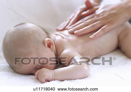 Baby massage View Large Photo Image Stock Image - Baby massage. Fotosearch