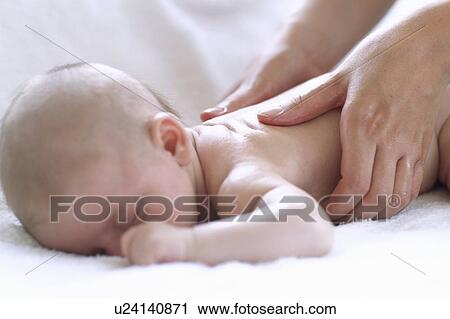 Baby massage View Large Photo Image Stock Image - Baby massage. Fotosearch