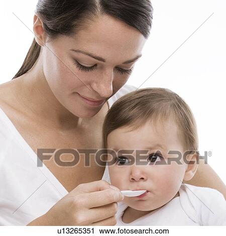 Baby taking medicine View Large Photo Image Stock Image - Baby taking medicine. Fotosearch