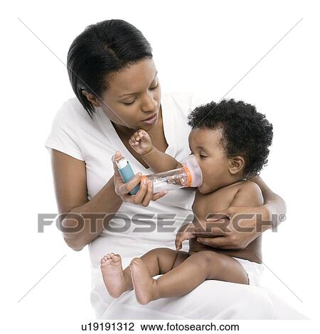 Stock Image - Baby using an asthma spacer. Fotosearch