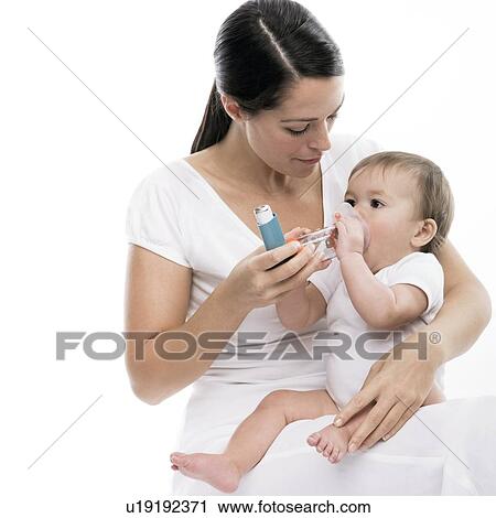 Stock Image - Baby using an asthma spacer. Fotosearch