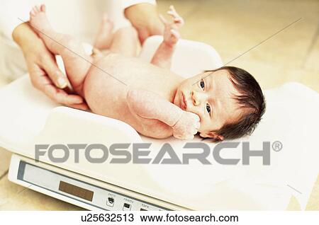 Baby weighing View Large Photo Image Stock Image - Baby weighing. Fotosearch