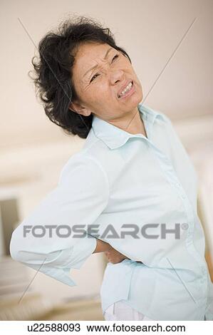 Stock Image - Back pain. Fotosearch