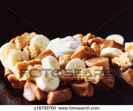 Stock Image - Banoffee pie ingredients, digestive biscuits, banana and toffee. Fotosearch