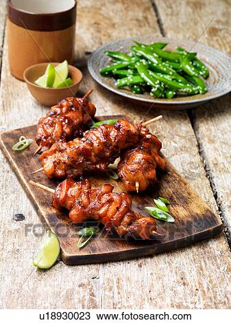 Barbecued teriyaki chicken kebabs on chopping board View Large Photo Image Stock Image - Barbecued teriyaki chicken kebabs on chopping board. Fotosearch