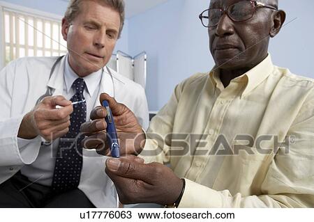 Stock Image - Blood glucose test. Fotosearch