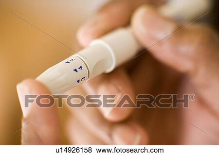 Stock Photo - Blood glucose test. Fotosearch