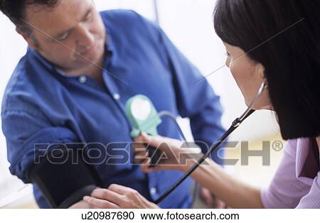 Stock Image - Blood pressure measurement. Fotosearch