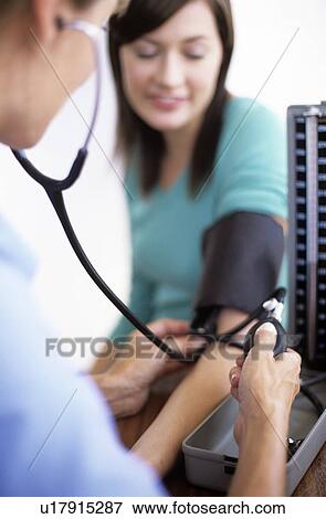 Stock Photo - Blood pressure measurement. Fotosearch
